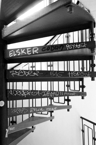 BW of graffiti on fire escape